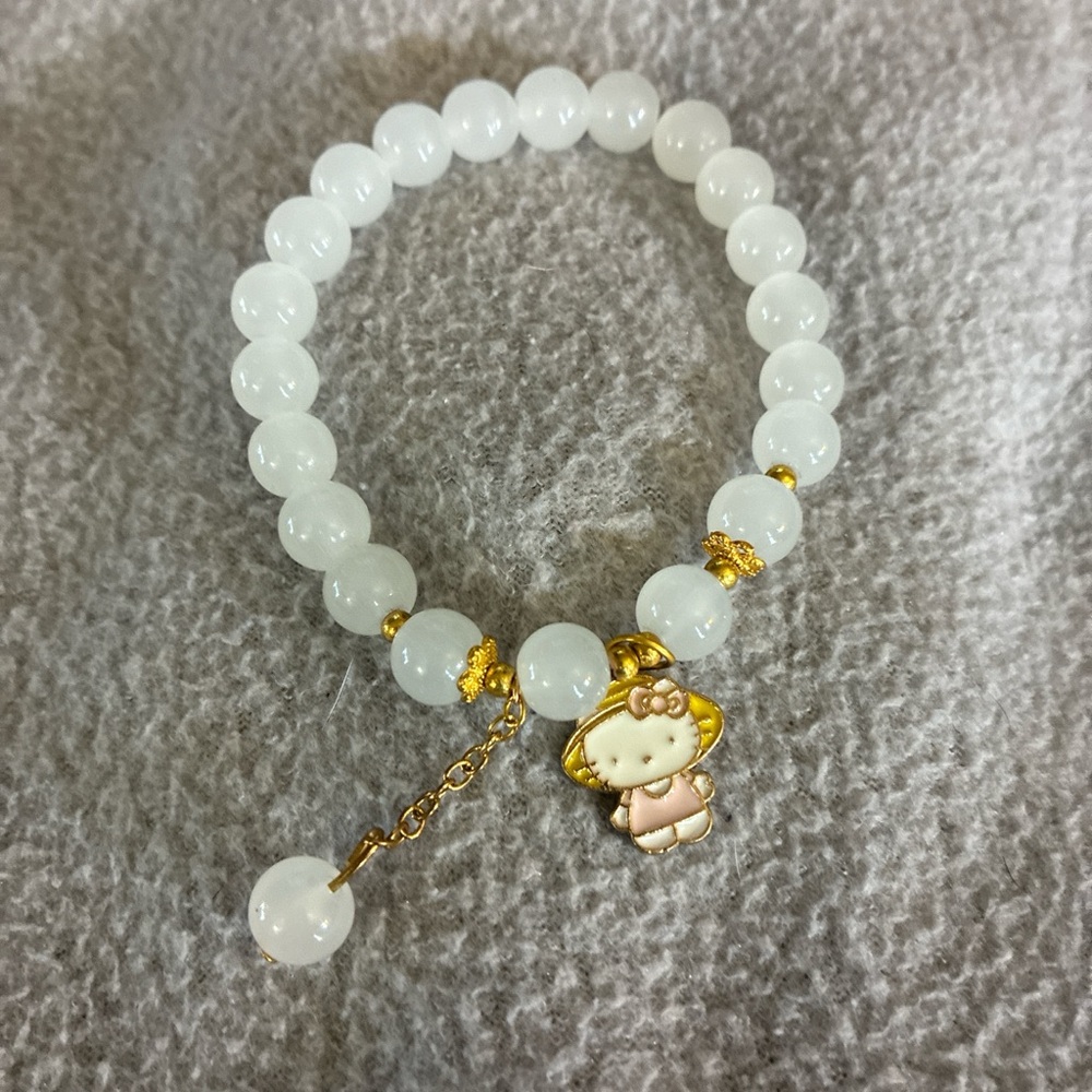 Gold and White Beaded Bracelet with Charm